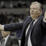 Max Good American basketball coach during game timeout at Maine Central Institute prep school