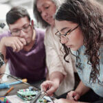 Nova Scola classroom showing students engaged in collaborative project-based learning with technology integration