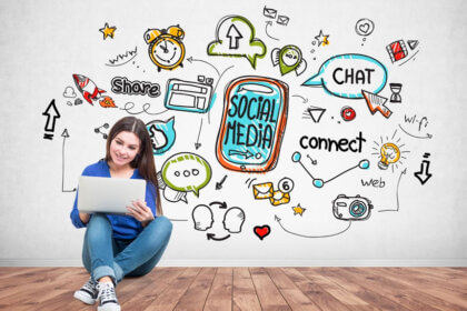 Tek-102 technology course students learning CAD software and engineering graphics on computers in classroom