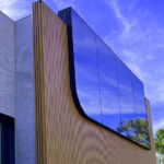 Modern aluminium cladding facade on commercial building showing fire-rated panels and thermal performance design