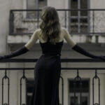 Elegant black tie outfit for ladies featuring floor length gown with accessories for formal events