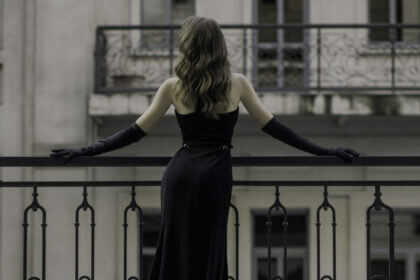 Elegant black tie outfit for ladies featuring floor length gown with accessories for formal events