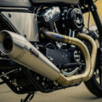 Escapamento rd expansion chamber exhaust system on Yamaha RD motorcycle showing chrome finish and performance design