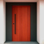Matte black door handles and hinges installed on white interior door showing modern hardware design