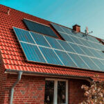 Residential solar roofing systems installed on modern home with solar shingles generating clean energy