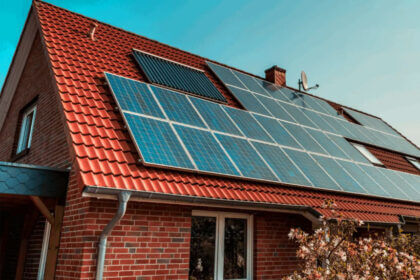 Residential solar roofing systems installed on modern home with solar shingles generating clean energy