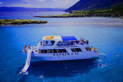 Traditional veneajelu boat ride on Finnish lake with peaceful summer scenery and forest backdrop