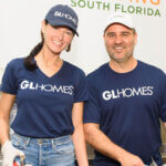Misha Ezratti wife Jessica Millman Ezratti volunteering at food bank in South Florida