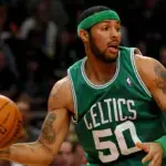 Eddie House standing courtside analyzing a basketball game. Eddie House Net Worth