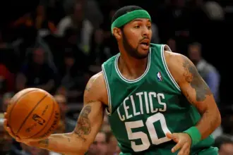 Eddie House standing courtside analyzing a basketball game. Eddie House Net Worth